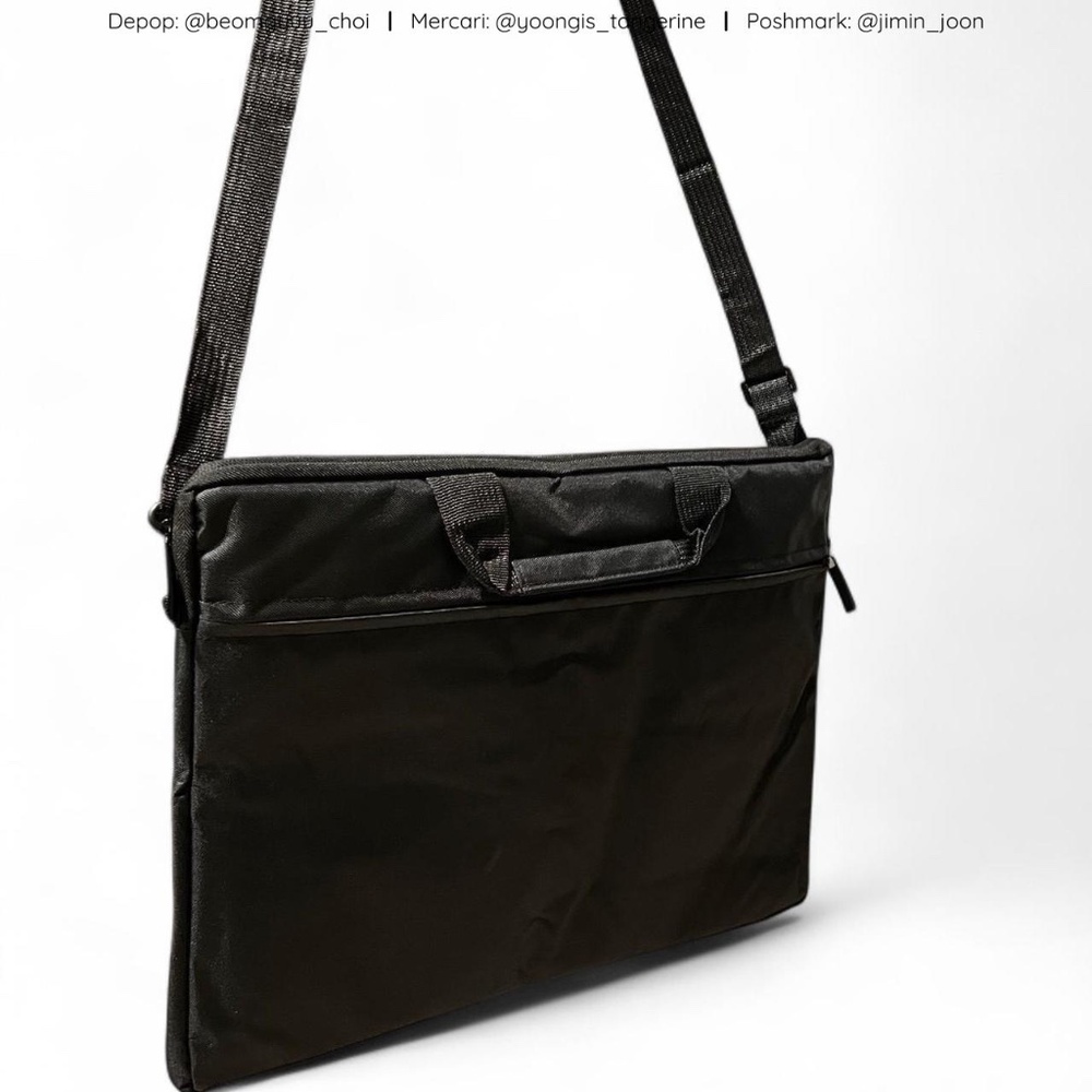 Black padded laptop case with detachable shoulder strap